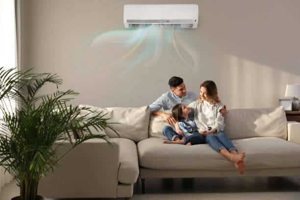 Young family enjoying the comfort of their new air conditioning installation.