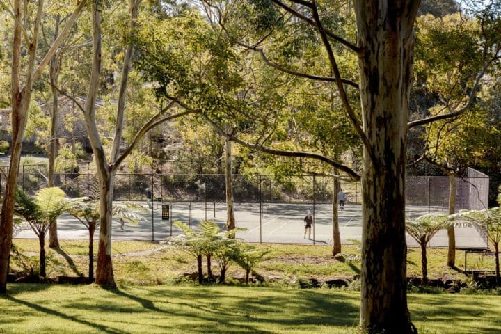 A tennis court and park in Turramurra