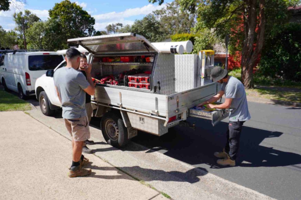 CCA workers getting tools from the ute